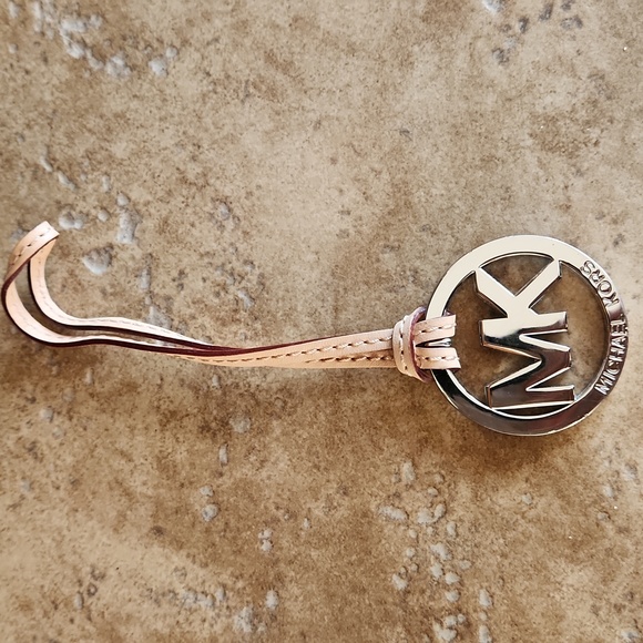 Michael Kors silver round purse charm on tan strap - Picture 2 of 7